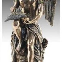 Amor (Cupid) sitting with doves. Beautiful decorative figure