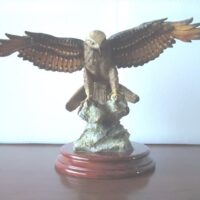 Eagle figure displayed with wooden base