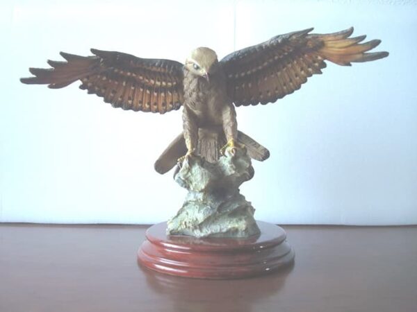 Eagle figure displayed with wooden base