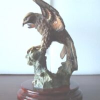 Eagle figure displayed with wooden base - Image 2