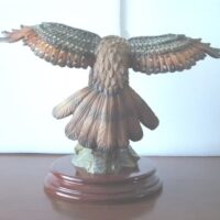 Eagle figure displayed with wooden base - Image 3