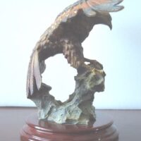 Eagle figure displayed with wooden base - Image 4
