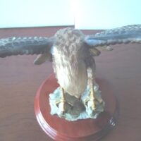 Eagle figure displayed with wooden base - Image 7